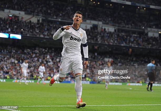 Cristiano Ronaldo of Real Madrid CF celebrates after scoring Real's 2nd goal during the La Liga match between Real Madrid CF and Malaga CF at estadio...
