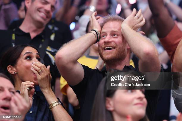 Meghan, Duchess of Sussex and Prince Harry, Duke of Sussex react during the sitting volleyball finals at the Merkur Spiel-Arena during day six of the...