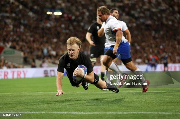 Damian McKenzie of New Zealand scores the team's third try during the Rugby World Cup France 2023 match between New Zealand and Namibia at Stadium de...