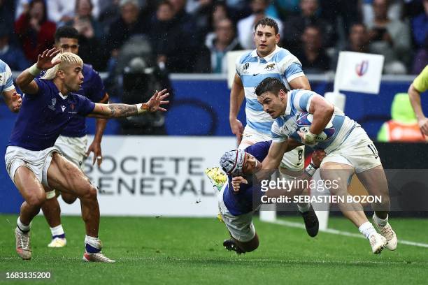Argentina's wing Mateo Carreras is tackled by Samoa's fly-half Christian Leali'ifano during the France 2023 Rugby World Cup Pool D match between...