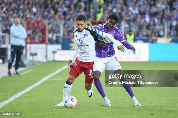 Ludovit Reis of Hamburg and Christian Conteh of Osnabrueck battle for the ball during the Second Bundesliga match between VfL Osnabrück and Hamburger...