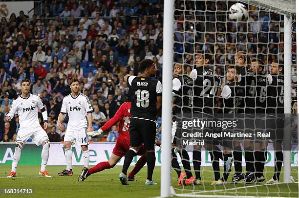 Cristiano Ronaldo of Real Madrid scores the second goal goal from a free kick during the La Liga match between Real Madrid and Malaga at Estadio...