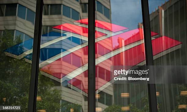 The Bank of America Corp. Logo is displayed inside of a branch in Charlotte, North Carolina, U.S., on Wednesday, May 8, 2013. Bank of America Corp....