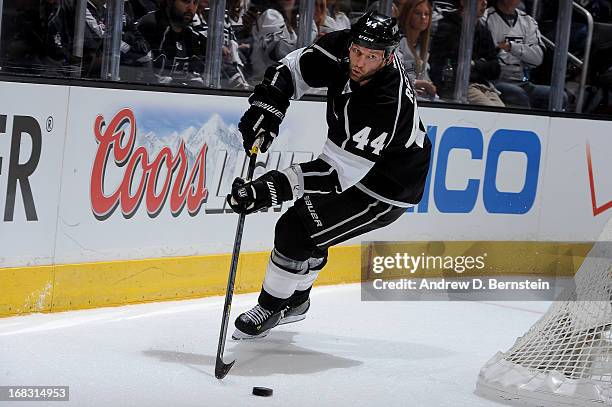 Robyn Regehr of the Los Angeles Kings skates with the puck against the St. Louis Blues in Game Three of the Western Conference Quarterfinals during...