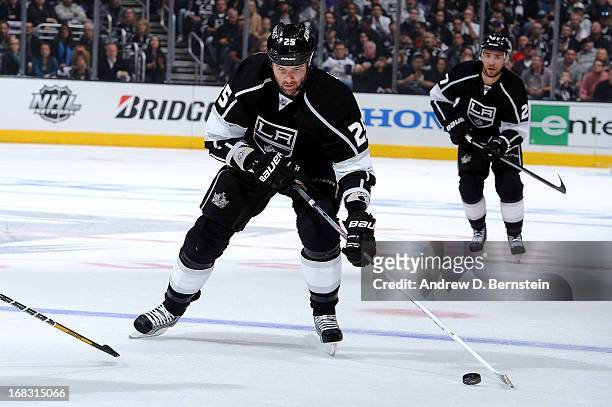 Dustin Penner of the Los Angeles Kings skates with the puck against the St. Louis Blues in Game Three of the Western Conference Quarterfinals during...