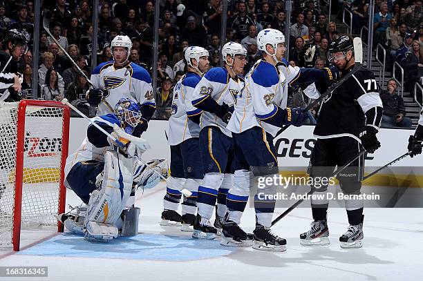 Alex Pietrangelo of the St. Louis Blues pushes Jeff Carter of the Los Angeles Kings in Game Three of the Western Conference Quarterfinals during the...