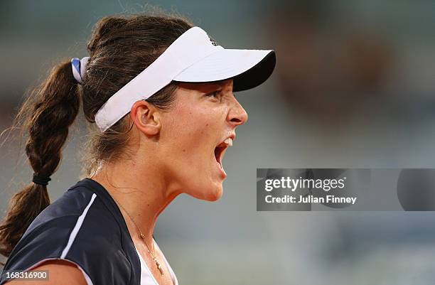 Laura Robson of Great Britain reacts in her match against Ana Ivanovic of Serbia during day five of the Mutua Madrid Open tennis tournament at the...