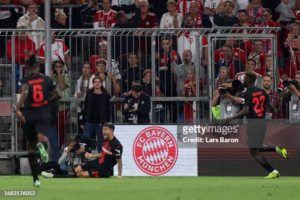 Exequiel Palacios of Bayer Leverkusen celebrates after scoring the team's second goal to equalise during the Bundesliga match between FC Bayern...