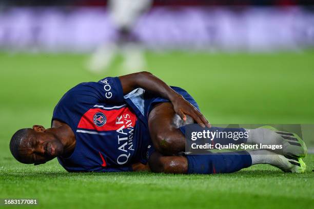 Ousmane Dembele of PSG injured on the pitch during the Ligue 1 Uber Eats match between Paris Saint-Germain and OGC Nice at Parc des Princes on...