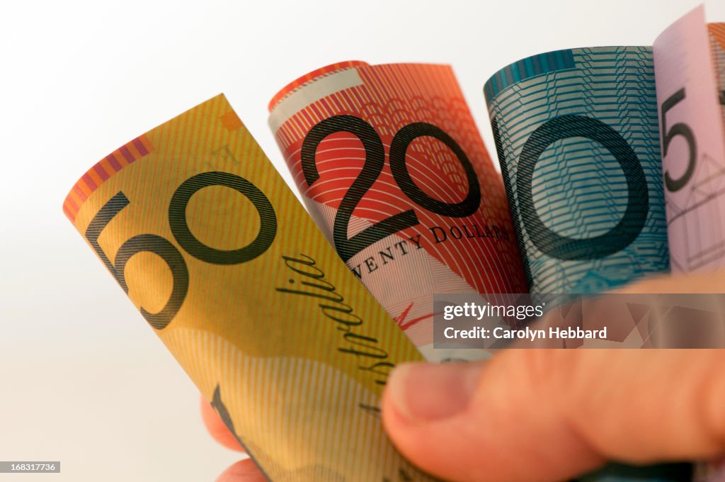 Australian Currency Notes Held In Hand