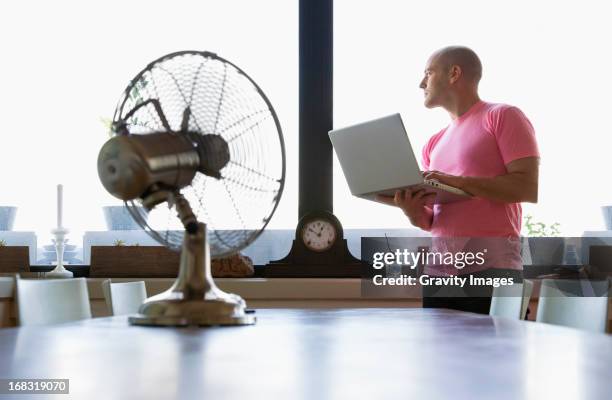 hot day with computer - table fan stock pictures, royalty-free photos & images