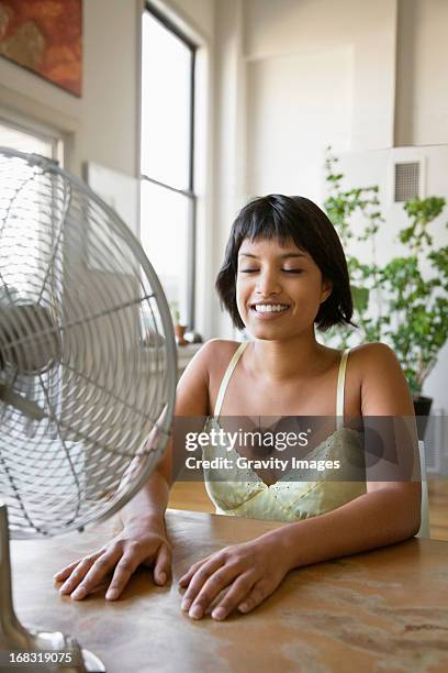 hot day indoors - table fan stock pictures, royalty-free photos & images