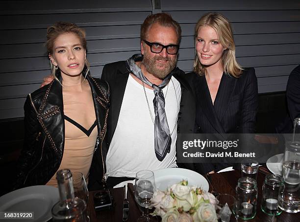 Elena Perminova, Johan Lindeberg and Caroline Winberg attend the BLK DNM Dinner with Johan Lindeberg and Kim Sion at Beagle Restaurant on May 8, 2013...