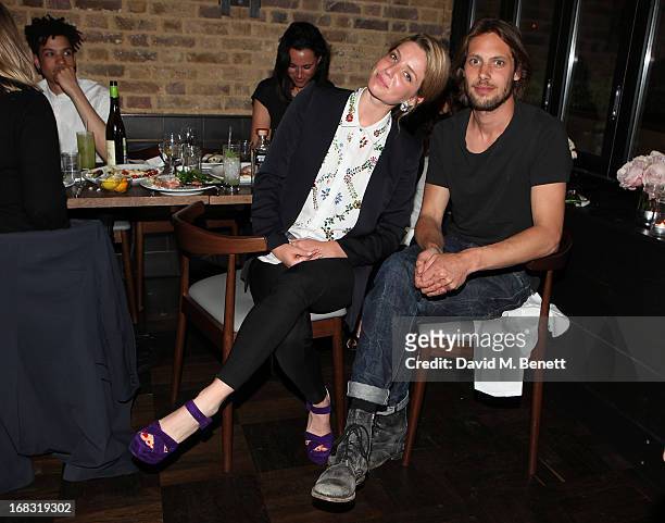 James Rousseau and Annabelle Wallis attend the BLK DNM Dinner with Johan Lindeberg and Kim Sion at Beagle Restaurant on May 8, 2013 in London,...