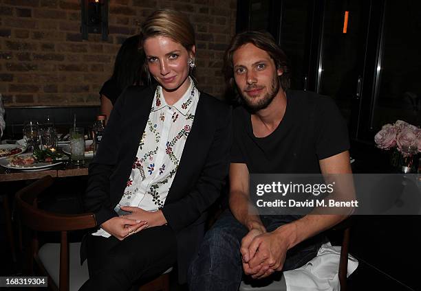 James Rousseau and Annabelle Wallis attend the BLK DNM Dinner with Johan Lindeberg and Kim Sion at Beagle Restaurant on May 8, 2013 in London,...