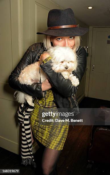 Jakki Healy holds dog Frankie Benett at a book launch party for "Pearl Lowe's Vintage Craft: 50 Craft Projects and Home Styling Advice" by Pearl Lowe...