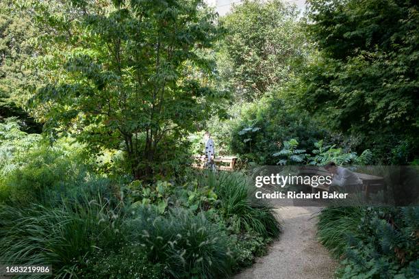 City worker enjoys a peaceful lunchtime in the City of London, the capital's finanial district, on 22nd September 2023, in London, England.