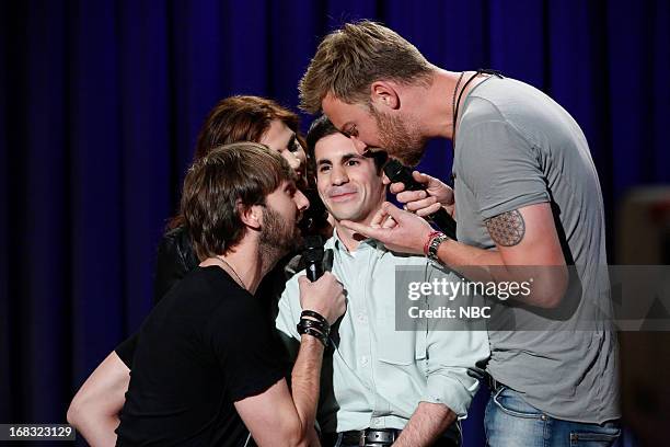 Episode 831 -- Pictured: Musical guests Dave Haywood, Hillary Scott, Charles Kelley of Lady Antebellum serenades an audience member on May 8, 2013 --