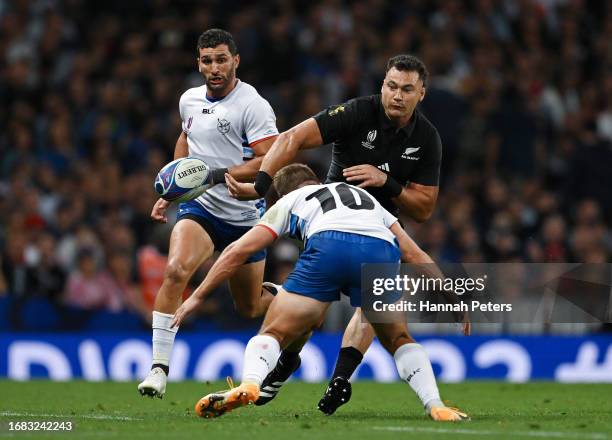 David Havili of New Zealand plays a pass ahead of Tiaan Swanepoel of Namibia during the Rugby World Cup France 2023 match between New Zealand and...