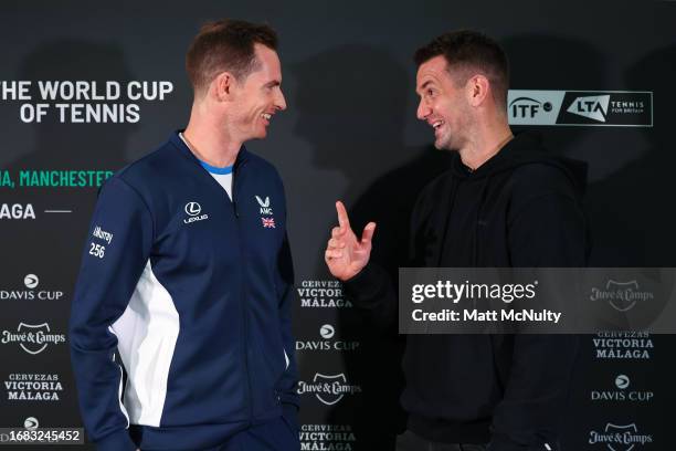Andy Murray of Team Great Britain speaks with Tom Heaton, Manchester United goalkeeper during the Davis Cup Finals Group Stage at AO Arena on...