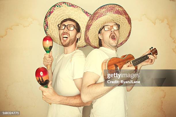 funny mariachi band with sombreros - maracas stockfoto's en -beelden