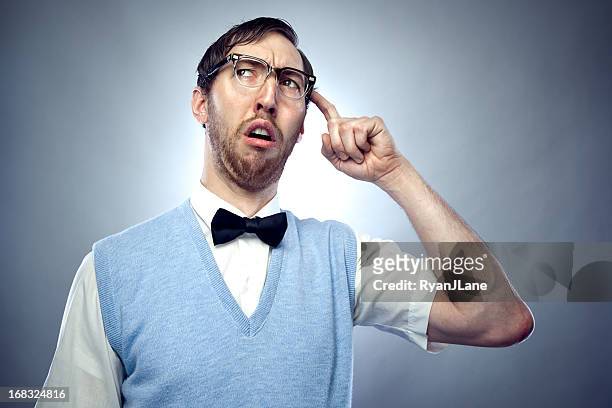 concentrating nerd student scratching head - ugly people stock pictures, royalty-free photos & images