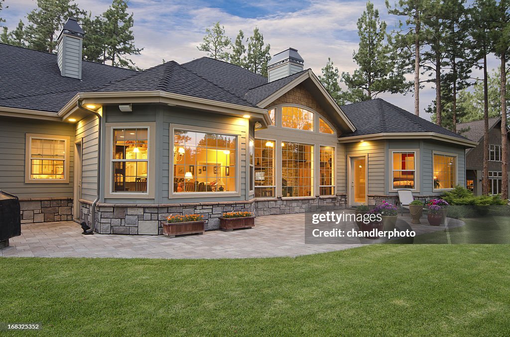 Twilight exterior of home and landscape