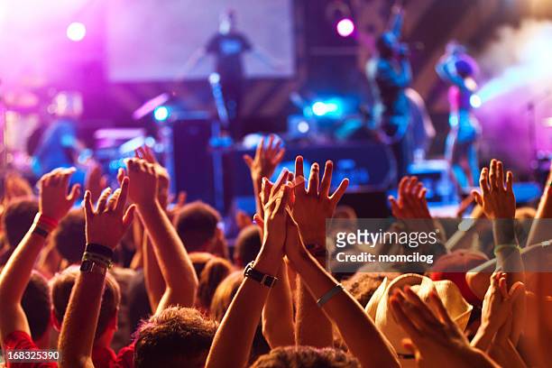 hands up at the concert - bands stockfoto's en -beelden