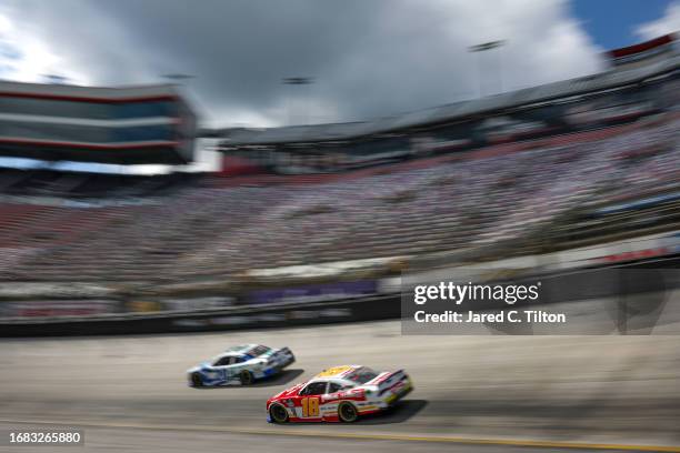 Sammy Smith, driver of the Pilot Flying J Toyota, and John Hunter Nemechek, driver of the Pye Barker Fire & Safety Toyota, drive during qualifying...