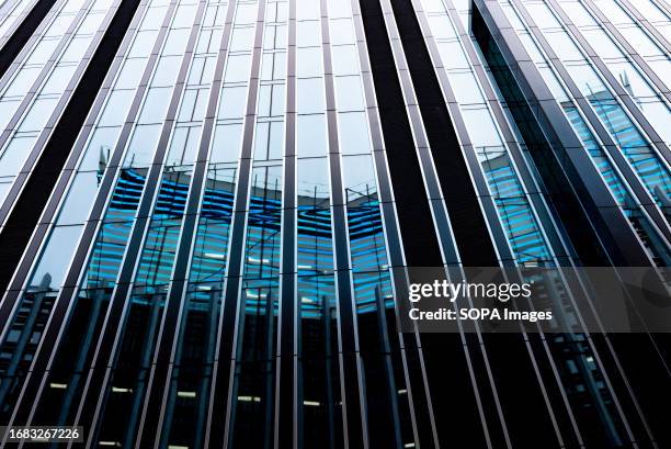 Modern abstract reflections in glass fronted office buildings in the financial district of the British capital London.