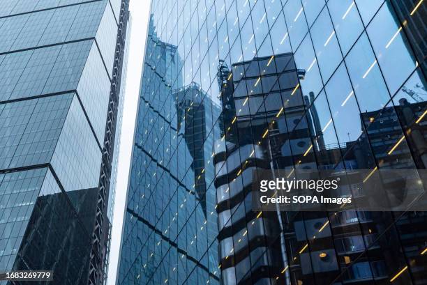 Modern abstract reflections in glass fronted office buildings in the financial district of the British capital London.