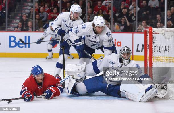 Jeff Halpern of the Montreal Canadiens shoots the puck past Ben Bishop of the Tampa Bay Lightning during the NHL game on April 18, 2013 at the Bell...