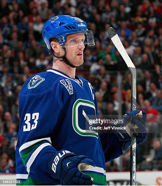 Henrik Sedin of the Vancouver Canucks looks on from the bench during their NHL game against the Detroit Red Wings at Rogers Arena April 20, 2013 in...