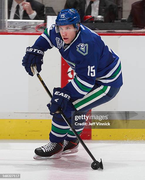 Derek Roy of the Vancouver Canucks skates up ice with the puck during their NHL game against the Detroit Red Wings at Rogers Arena April 20, 2013 in...