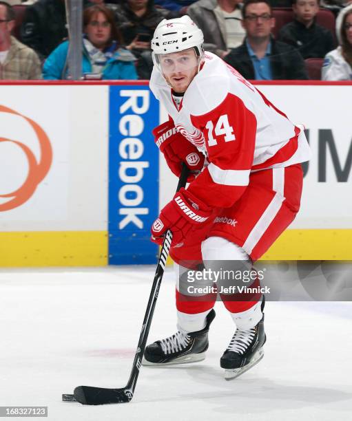 Gustav Nyquist of the Detroit Red Wings skates up ice with the puck during their NHL game against the Vancouver Canucks at Rogers Arena April 20,...