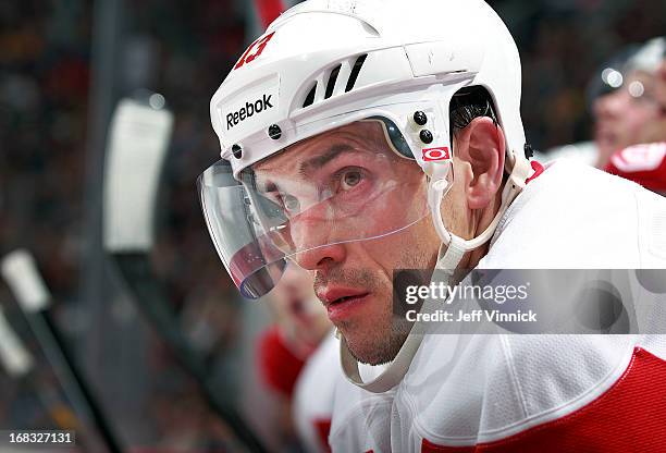 Pavel Datsyuk of the Detroit Red Wings looks on from the bench during their NHL game against the Vancouver Canucks at Rogers Arena April 20, 2013 in...