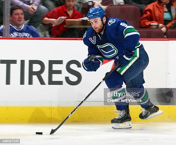 Zack Kassian of the Vancouver Canucks skates up ice with the puck during their NHL game against the Detroit Red Wings at Rogers Arena April 20, 2013...