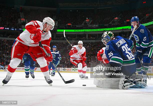 Cory Schneider of the Vancouver Canucks makes a save off the shot of Gustav Nyquist of the Detroit Red Wings during their NHL game at Rogers Arena...