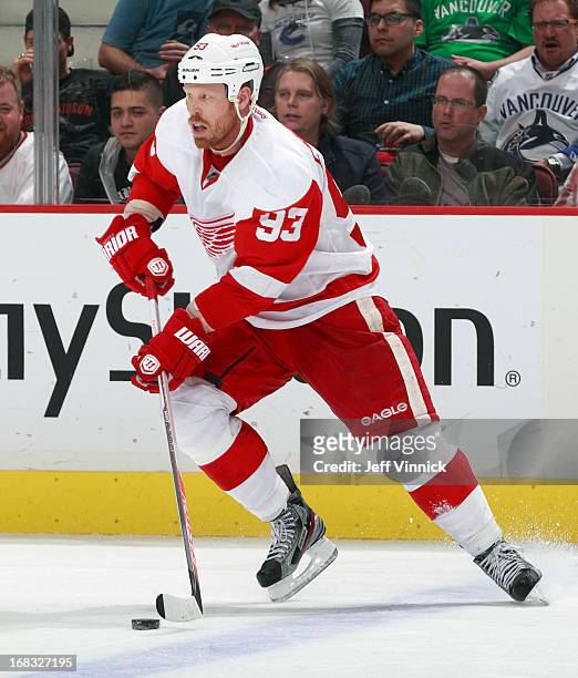 Johan Franzen of the Detroit Red Wings skates up ice with the puck during their NHL game against the Vancouver Canucks at Rogers Arena April 20, 2013...