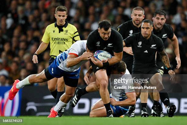 David Havili of New Zealand runs with the ball whilst under pressure from players of Namibia during the Rugby World Cup France 2023 match between New...