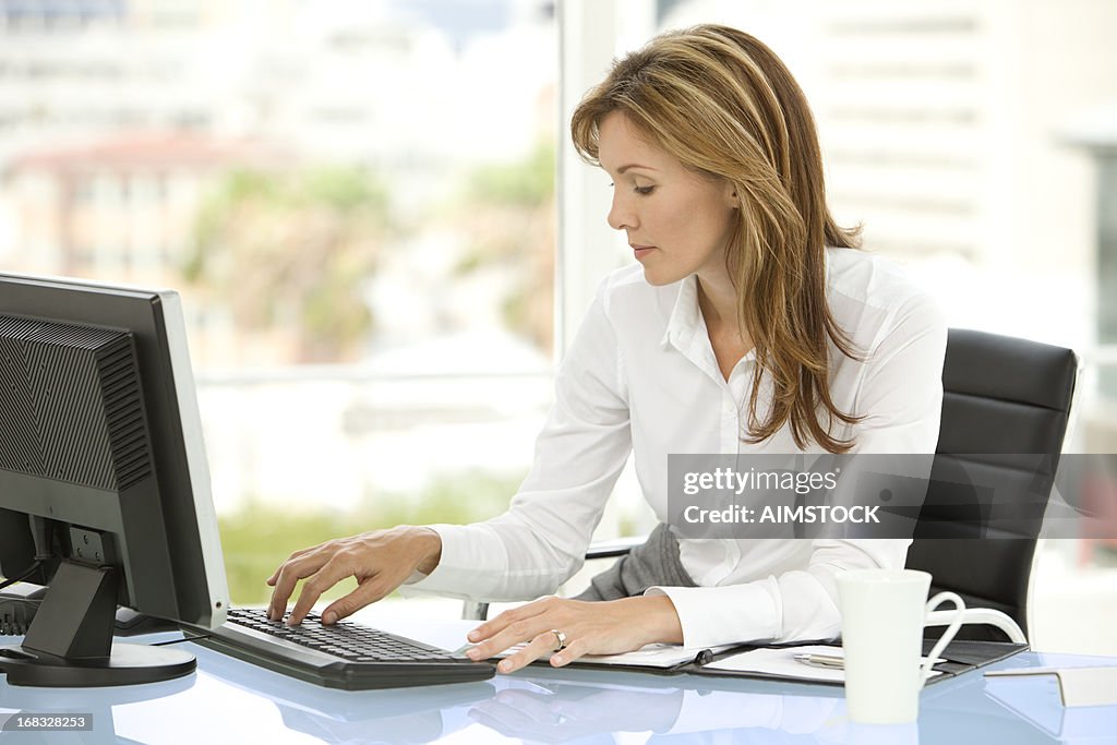 Beautiful businesswoman at workplace