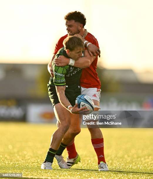 Galway , Ireland - 22 September 2023; John Porch of Connacht is tackled by Jack Daly of Munster during the pre season friendly match between Connacht...