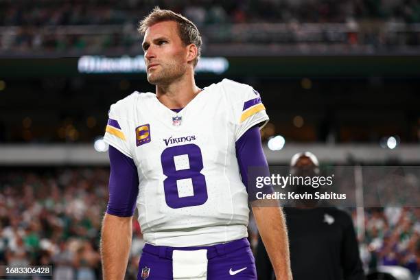 Kirk Cousins of the Minnesota Vikings stands on the sidelines during the national anthem prior to an NFL football game against the Philadelphia...