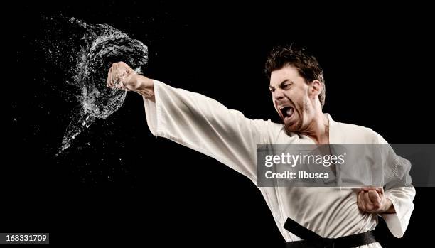 martial art water splash punch - knockout punch stock pictures, royalty-free photos & images