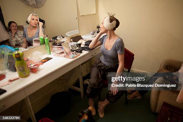 Dancer Nataliya Kungurtseva of the Classical Russian Ballet sits at backstage before a rehearsal of 'Swan Lake' at Nuevo Apolo Theatre on May 8, 2013...