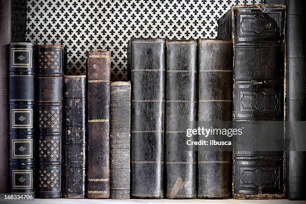 antique book on a shelf - book spine stock pictures, royalty-free photos & images