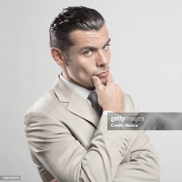 pensive young businessman - young man blue eyes stock pictures, royalty-free photos & images