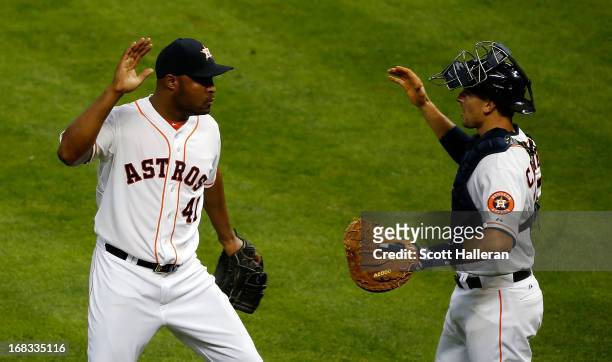 Jose Veras and Jason Castro of the Houston Astros celebrate a 3-1 victory over the Los Angeles Angels of Anaheim at Minute Maid Park on May 8, 2013...