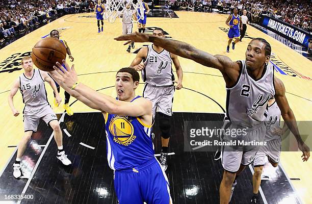Klay Thompson of the Golden State Warriors takes a shot against Kawhi Leonard of the San Antonio Spurs during Game Two of the Western Conference...