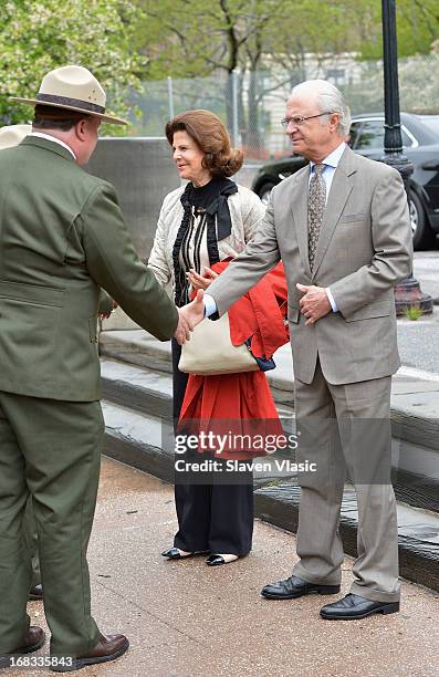 Queen Silvia of Sweden and King Carl XVI Gustaf of Sweden visit Castle Clinton National Monument at Battery Park on May 8, 2013 in New York City.